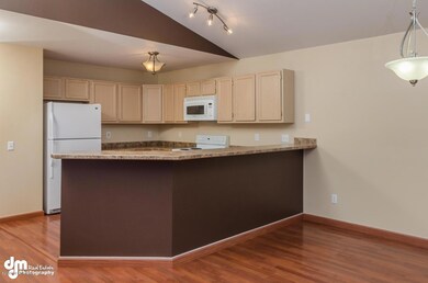 Kitchen w/bar top seating & area dining