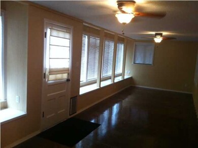 Gorgeous Sunroom with Shiney Stianed Concrete Floo