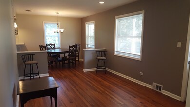 Living room has oak hardwood floors