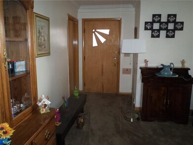 Separate entry area with decorative wood door & cl