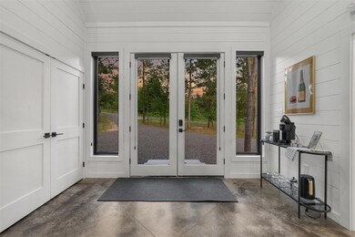 Entryway featuring plenty of natural light, high v