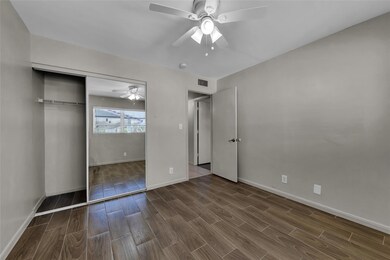 Wood Like flooring and mirrored closet in 2nd bedr