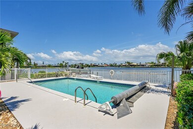 View of swimming pool with a patio and a water vie