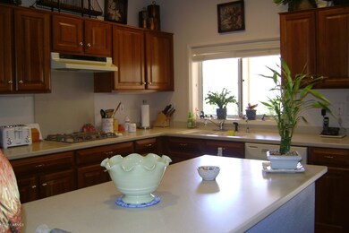 Kitchen With Island and Honey Cherry Woo