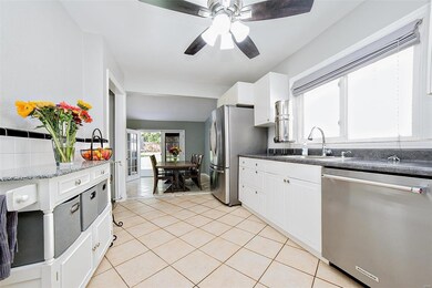 Kitchen with white cabinets and ceramic tile flooring