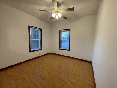 BRIGHT AND SUNNY KIVING ROOM WITH UPDATED VINYL WI