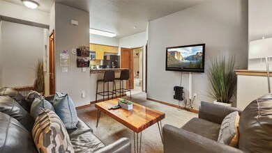 Living room featuring light colored carpet