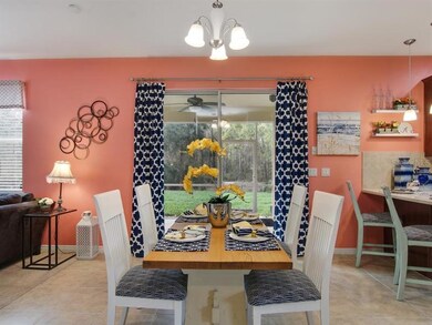 The eat-in nook has sliders to the extended patio 