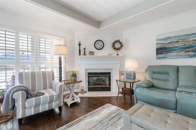Cozy fireplace with marble hearth and surround! Wa