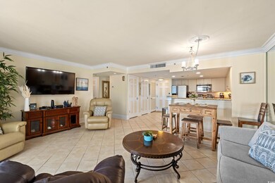 Living room featuring crown molding, visible vents