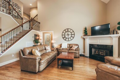 Look at all the seating room and the gorgeous mantle surrounding this gas fireplace.