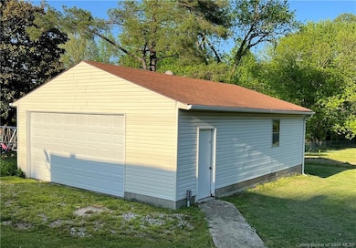 24 X 32 garage with concrete floor and electric.