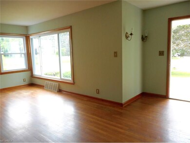 Beautiful hardwood floors in the living room . Win