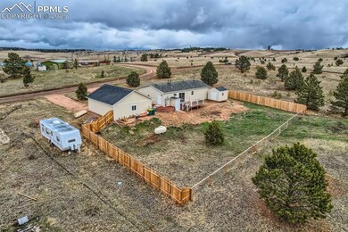 Birds eye view of property with a rural view
