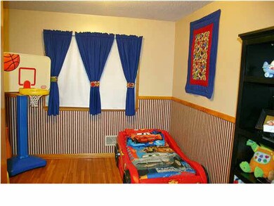 The middle bedroom has oak floors