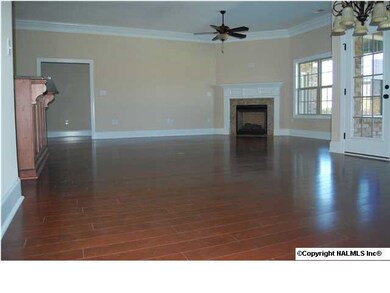 Open floorplan with vented gas fireplace in gathering room