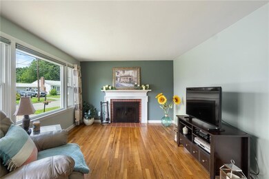Light and bright living room with a wood burning f