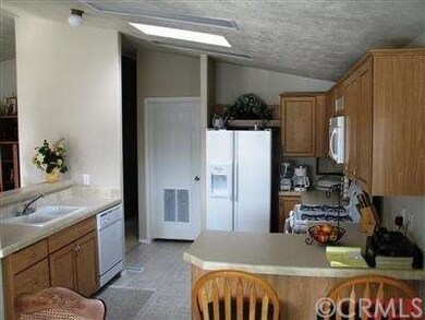 Kitchen with skylight and cathedral ceilings