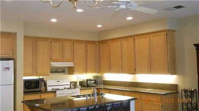 Kitchen offers abundant cabinet and counter space,