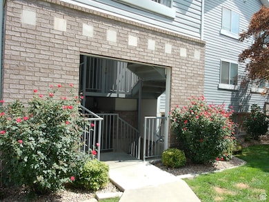 View of exterior entry with brick siding