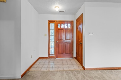 The gracious entry leads to the everyday living spaces.