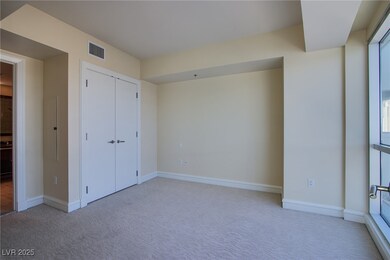 Unfurnished bedroom with carpet floors, baseboards