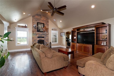 Living room features a charming wood burning firep