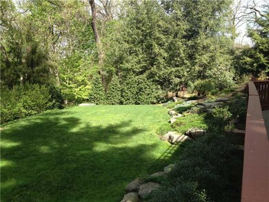 Exterior Back. A view of one side of the rear yard