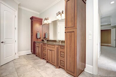 Master Bathroom with granite, custom cabinets and 