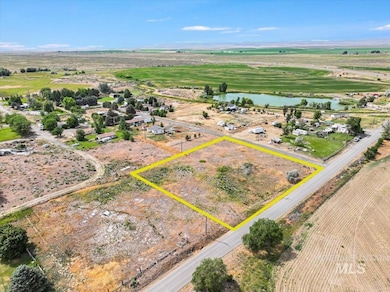 Overview of rural landscape featuring a large body of water and property boundaries highlighted
