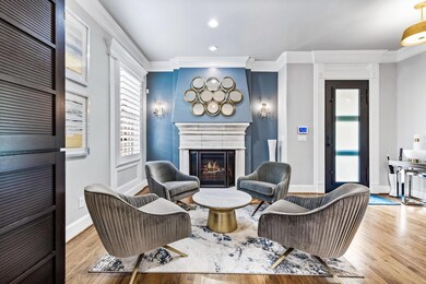Living room featuring light hardwood / wood-style 