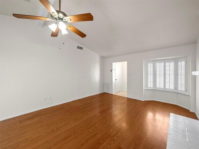 Unfurnished room featuring visible vents, baseboar