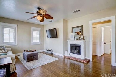 Alternate view of living room with hardwood floors