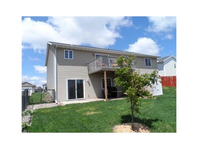 Exterior Back. Completely fenced yard with patio a