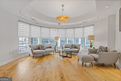 This living space is the perfect city living space.  The wall of windows is the perfect accent to this room.