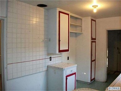 Kitchen with Door to Washer and Dryer area and Bac