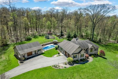 This view captures the home, detached garage with