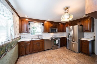 Large eat-in kitchen is appointed with stainless s