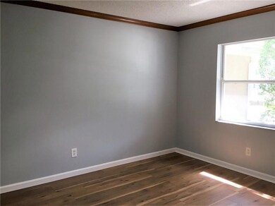 There are new laminate floors through the den, kitchen, dining area, hallways, and bedrooms, too.