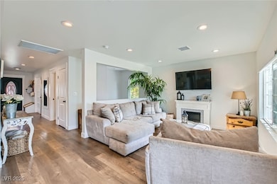 Living area featuring wood finished floors, recess