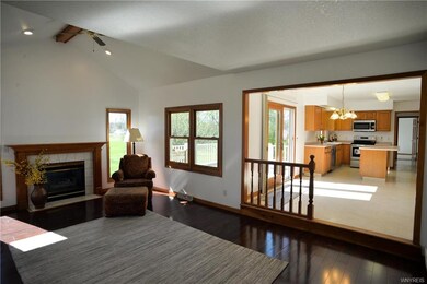 The family room features wood floors, plenty of na