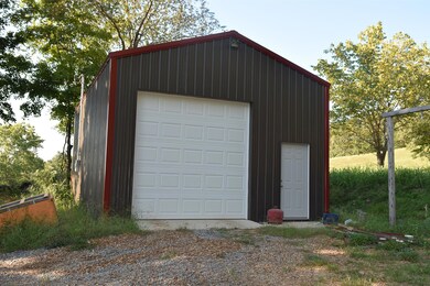 Shop with Concrete Floor and Electric.