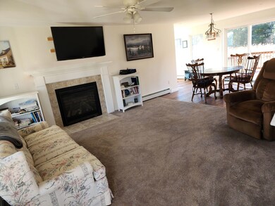 living room looking to dining and back y