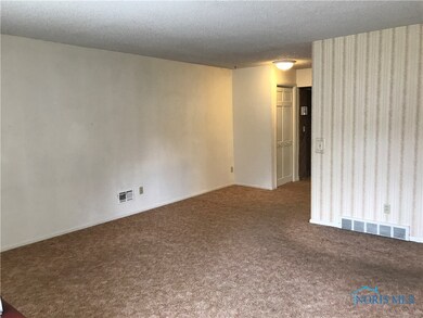 Living room flows into dinette area.