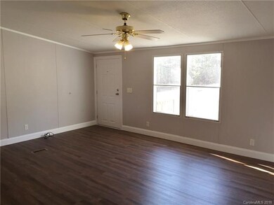 Den with view of the front door