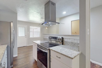 Kitchen featuring stainless steel appliances, isla