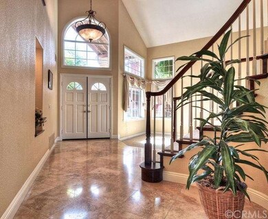 Elegant entrance with soaring ceilings and stunnin