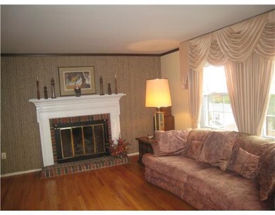 Living Room. Gas log fireplace and large window