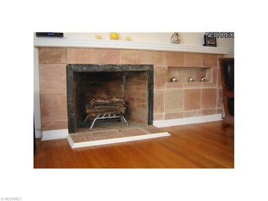 Expansive wood burning fireplace features extra la