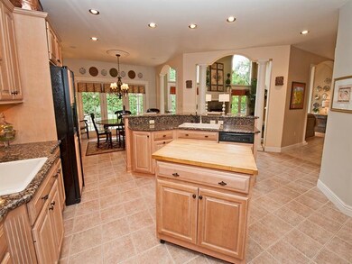 KITCHEN AREA OPEN TO FAMILY ROOM. POWDER ROOM, LAU